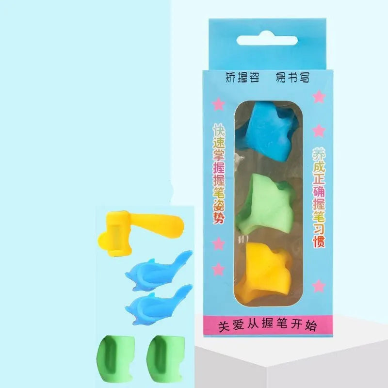 Children's writing orthosis set with five coloured pencil grips and a corrector tool on a table.