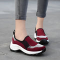 Ladies casual mesh wedge heel platform shoes in black, side view showing hollow mesh upper and round toe
