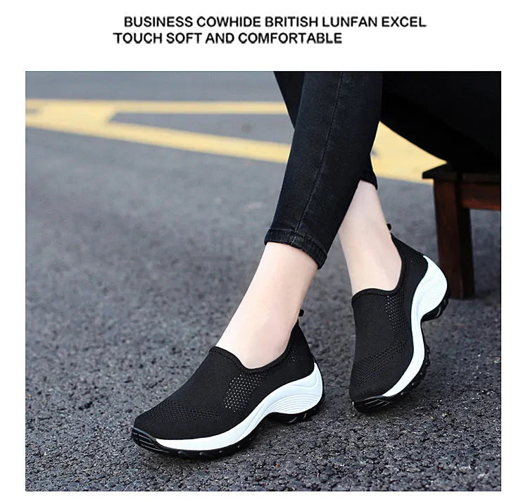 Ladies casual mesh wedge heel platform shoes in black, side view showing hollow mesh upper and round toe