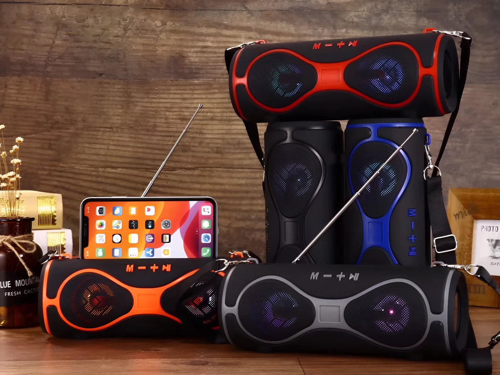 Portable lantern-style Bluetooth speaker with a carrying strap and built-in mobile phone stand.