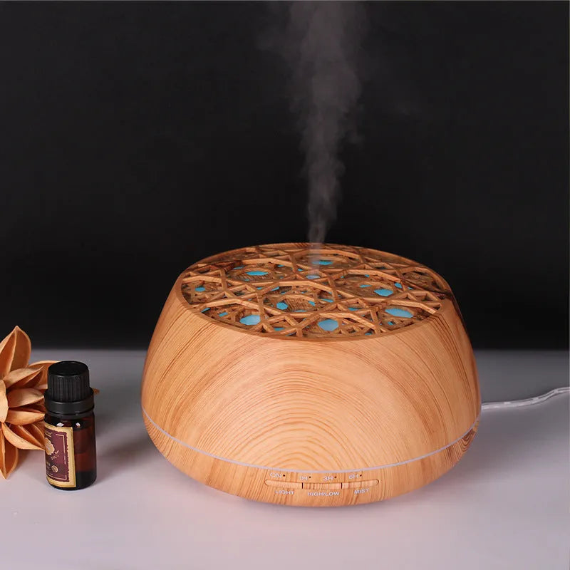 Four-hole misting ultrasonic aroma diffuser in dark wood grain finish with 400ml capacity and control buttons