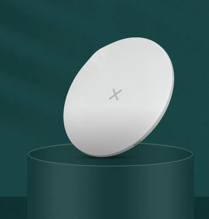Ultra-thin round 15W wireless charger in Black with indicator light on a desk
