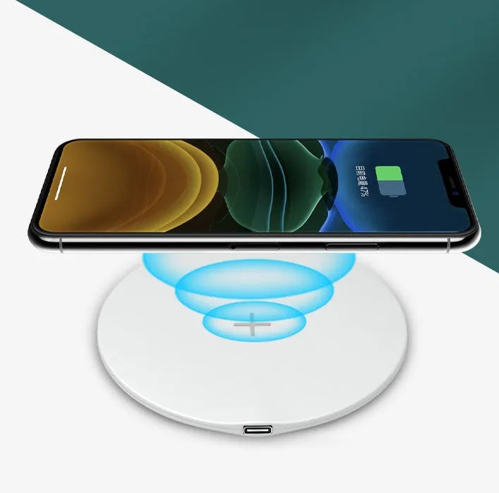 Ultra-thin round 15W wireless charger in Black with indicator light on a desk