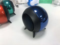 Mini metal Bluetooth speaker in black with button controls and metal grille