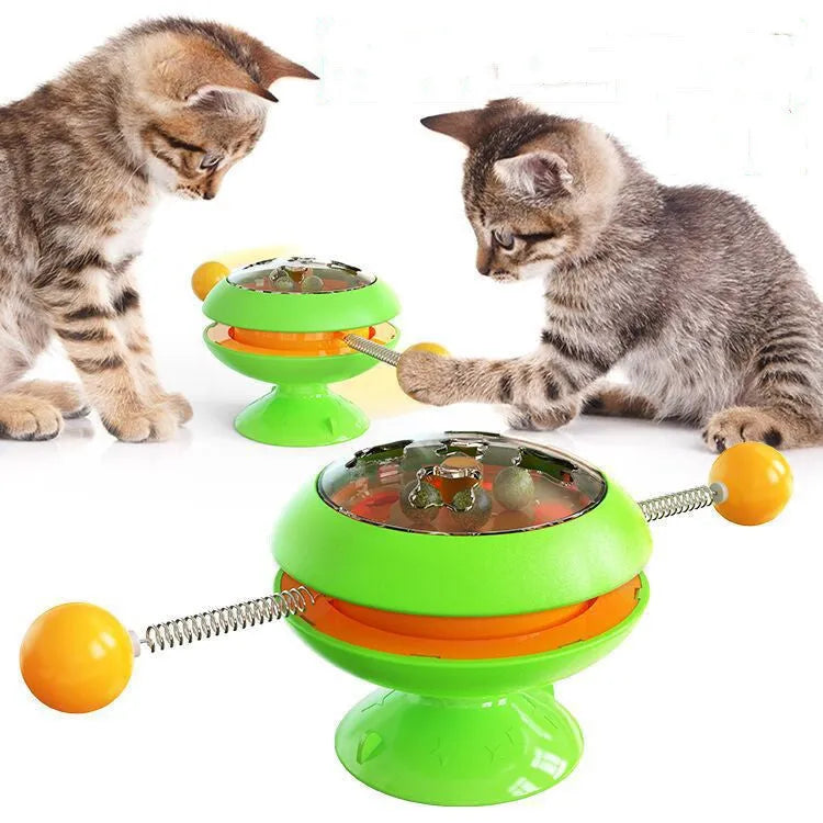 Rotatable interactive cat toy with suction cup base and colourful turntable featuring catnip balls.