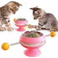 Rotatable interactive cat toy with suction cup base and colourful turntable featuring catnip balls.