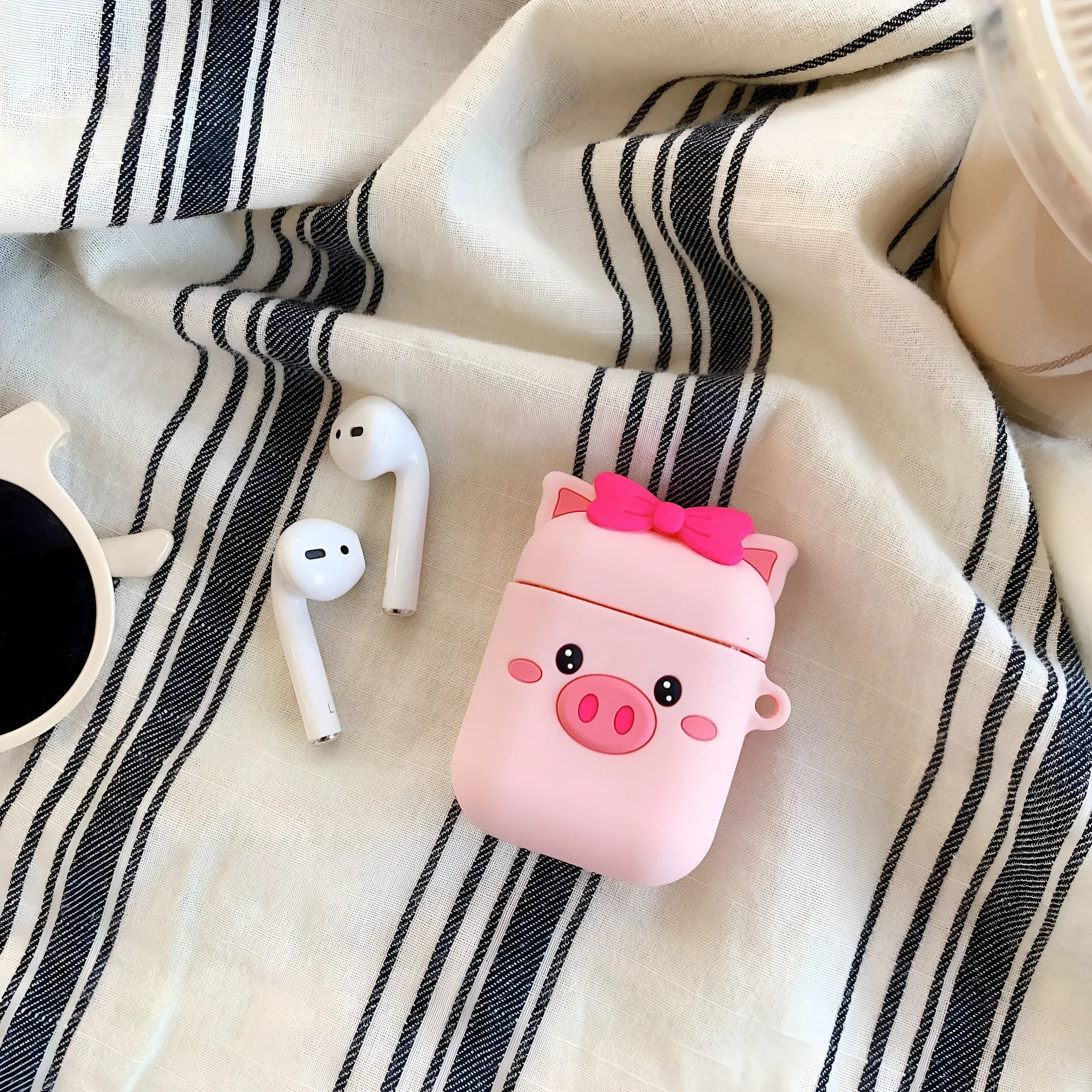Pink silicone protective case for AirPods with cartoon animal design, back cover style