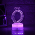 3D LED night light glowing with colour-changing light on a diamond ring laser engraving inside a black base.