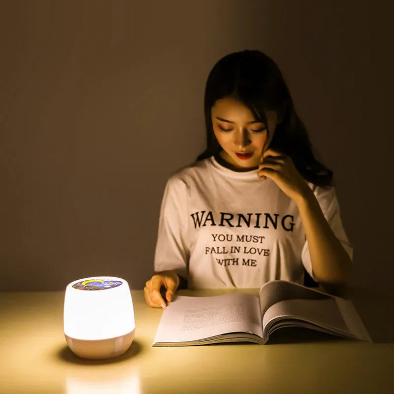 Smart rotating LED projector night light showing star patterns on a bedroom ceiling.