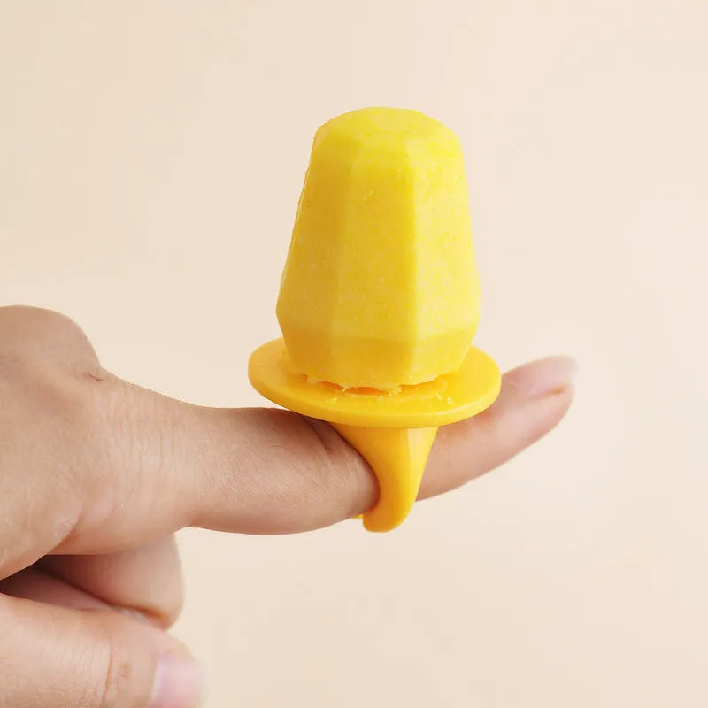 Brown plastic ice cube mould with cartoon anti-drip rim and honeycomb-shaped cavities