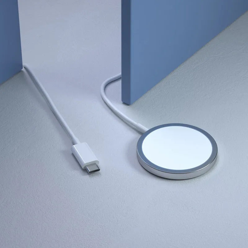 White 15W magnetic wireless charger for MagSafe iPhones on desk with 1m cable