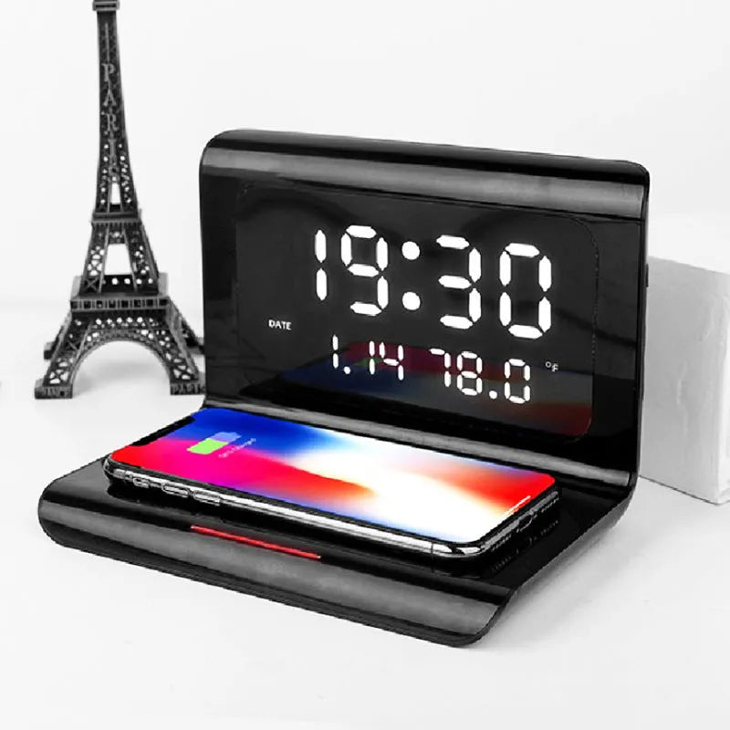 White wireless charger alarm clock showing time, date, temperature, and humidity on its display.