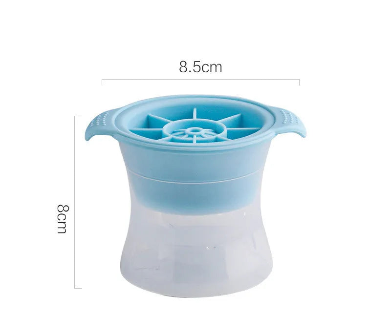 Flexible silicone ice tray showing large ice hockey, pentagon, and spherical mould designs in light blue.