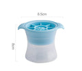 Flexible silicone ice tray showing large ice hockey, pentagon, and spherical mould designs in light blue.