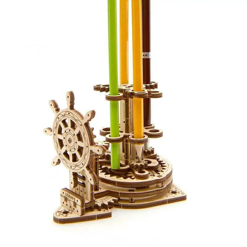 Solid wooden steering wheel pen holder with central pencil compartment on a desk