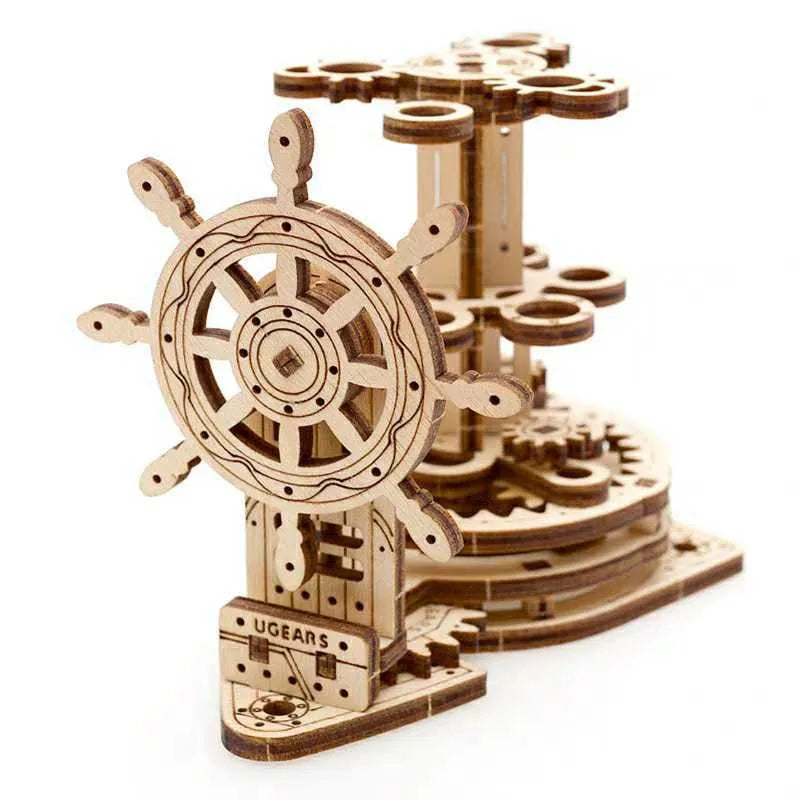 Solid wooden steering wheel pen holder with central pencil compartment on a desk