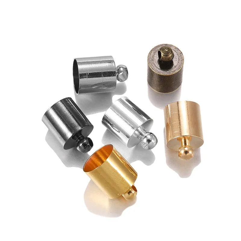 Assortment of small, bell-shaped copper caps in gold, silver, bronze, and black finishes for jewellery making.