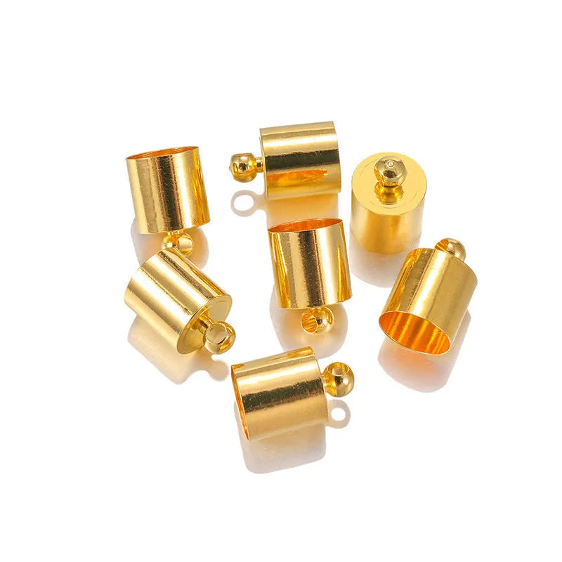 Assortment of small, bell-shaped copper caps in gold, silver, bronze, and black finishes for jewellery making.