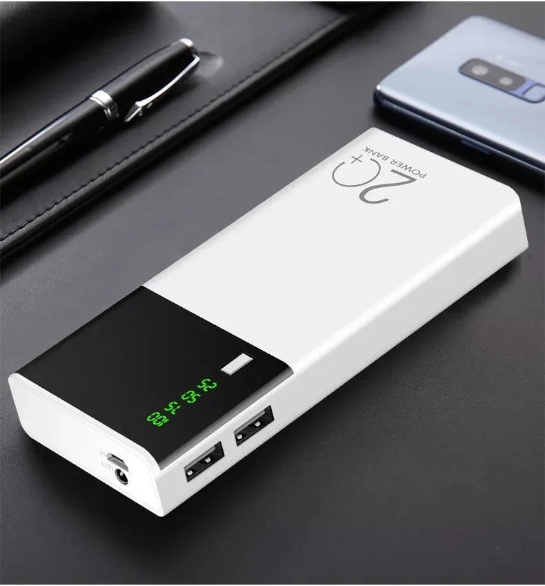 Black 20000mAh portable power bank with USB charging cable on a white background.