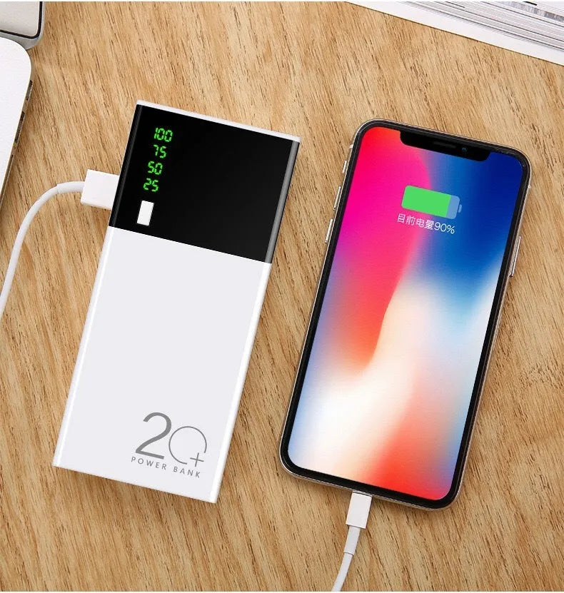 Black 20000mAh portable power bank with USB charging cable on a white background.