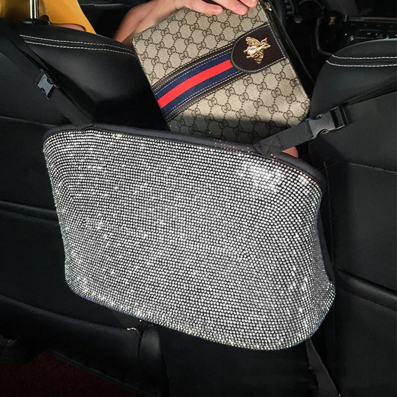 Crystal rhinestone car storage bag organizer with multi-pockets attached to backseat of car, showing white and colour options