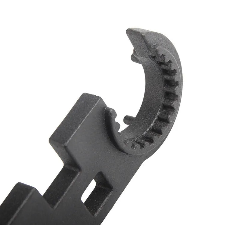 Black dual-purpose steel combination wrench for AR15 and M4 firearms maintenance.