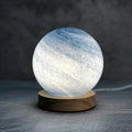 Girl Heart Planet bedside lamp with glass shade in chosen colour, showing button switch and USB cable