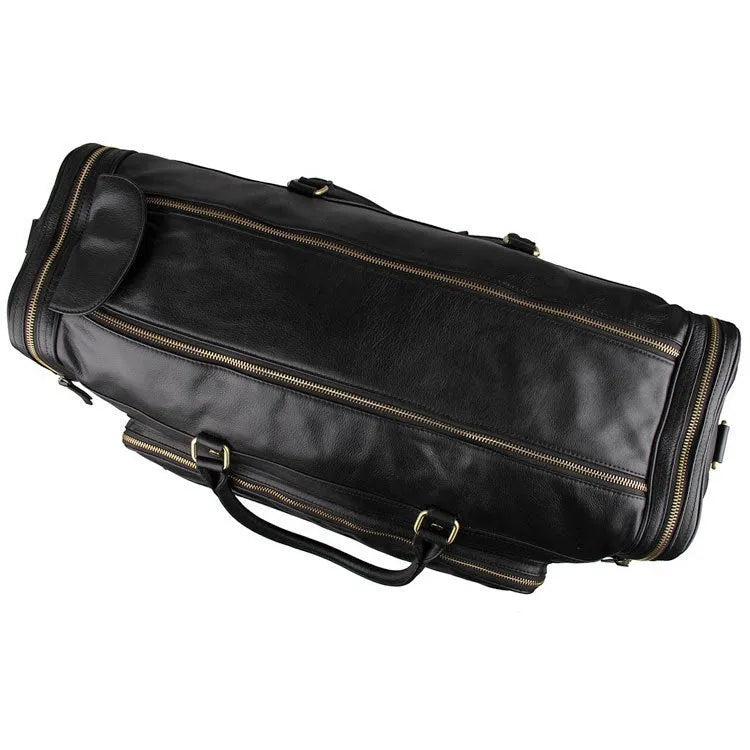 Large black leather travel bag in first layer cowhide with shoulder strap and zipper closure for men