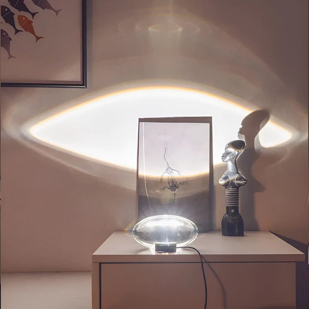 Projection lamp with crystal shade emitting warm LED light on a desk, 160x90 mm