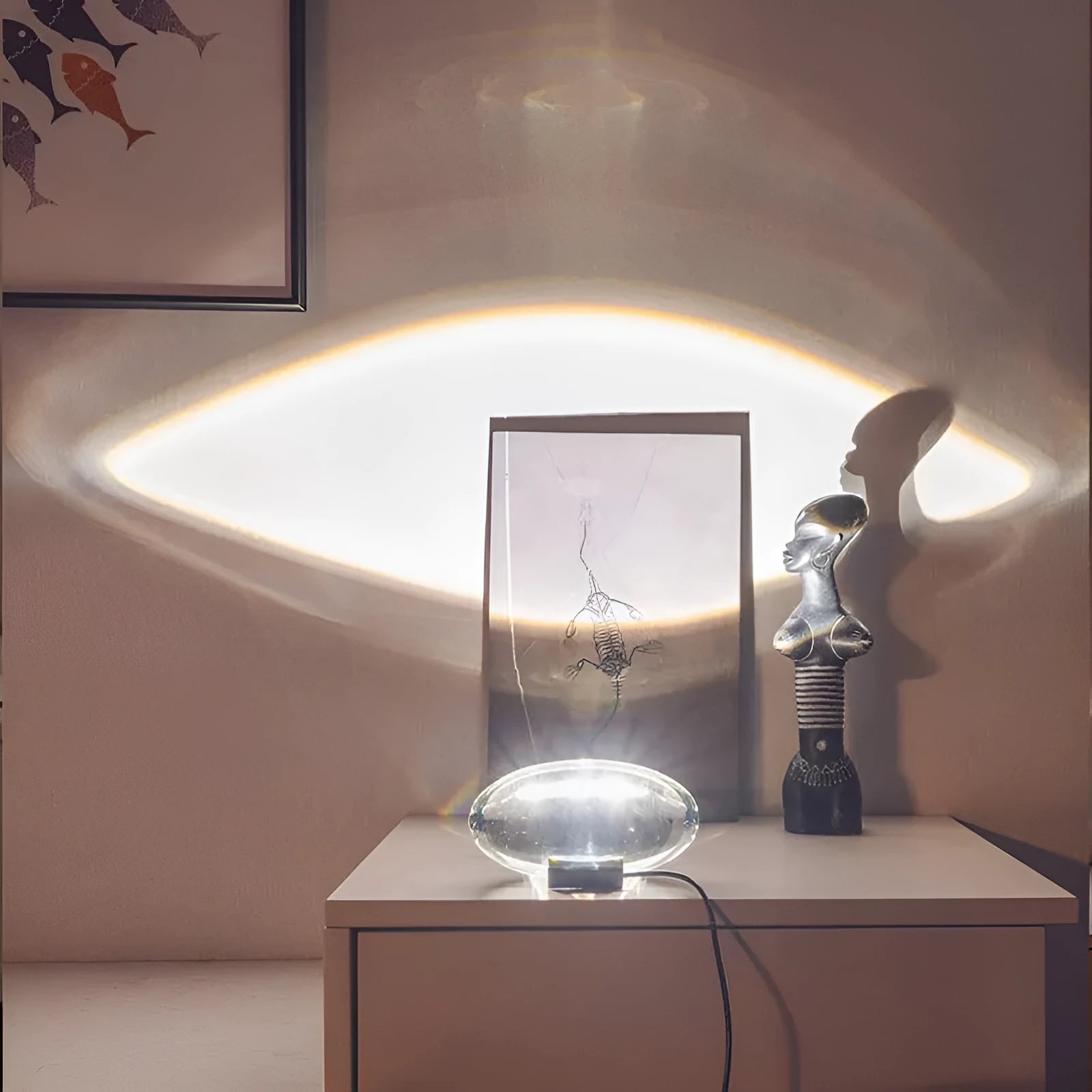 Projection lamp with crystal shade emitting warm LED light on a desk, 160x90 mm