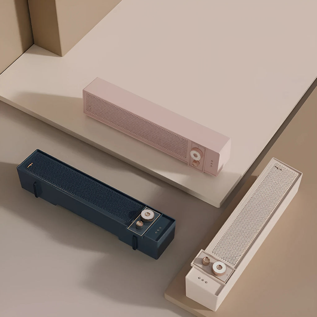 Retro style portable Bluetooth speaker in blue, pink, or white with multiple connectivity ports