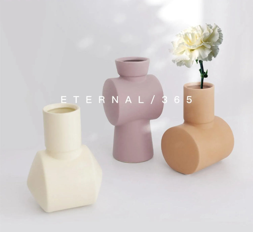 Morandi style ceramic vase with hammered texture in beige, brown, or purple.