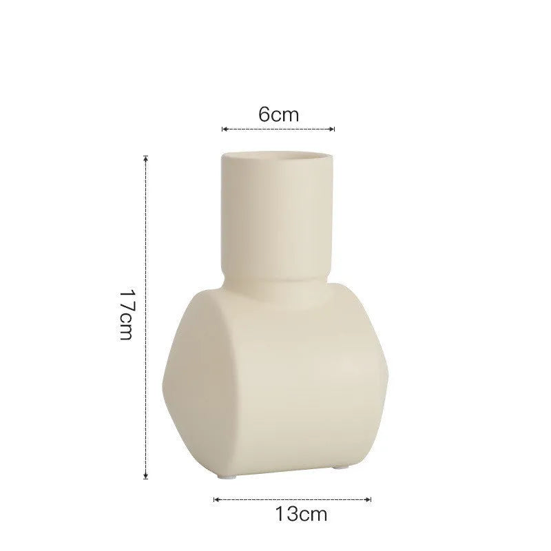 Morandi style ceramic vase with hammered texture in beige, brown, or purple.