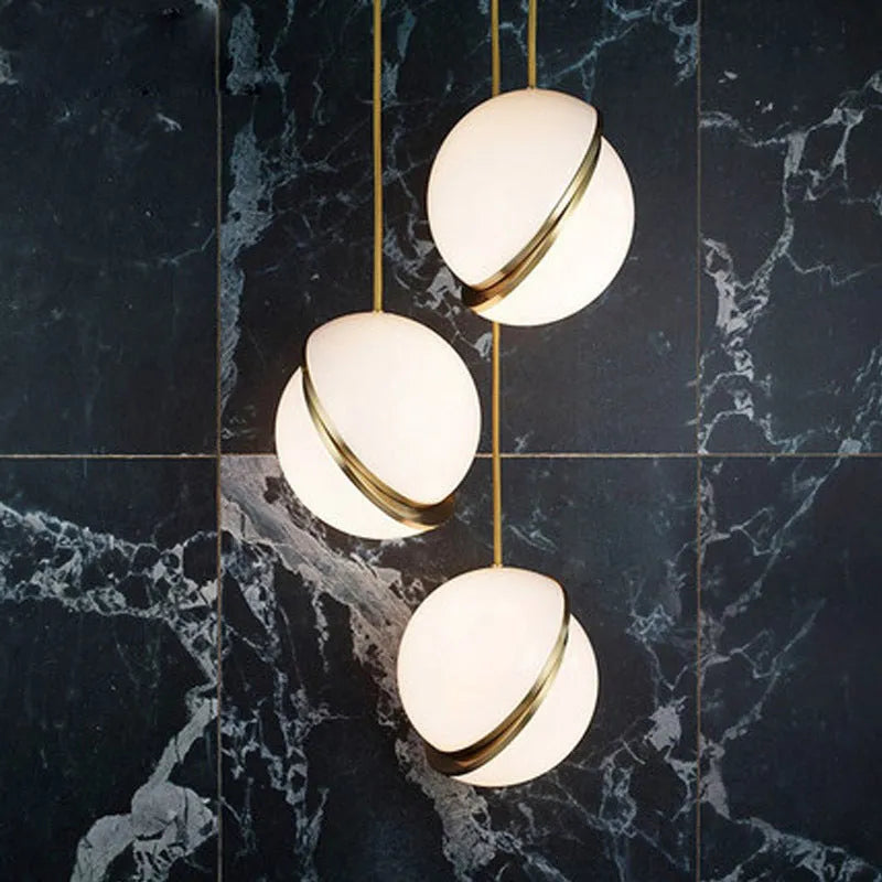 White spherical LED pendant light with adjustable chain for dining room or bedroom ceiling mounting