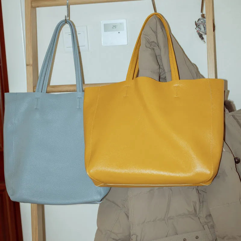 Large first layer cowhide leather tote bag with soft handle, plain design with car stitching, available in multiple colours