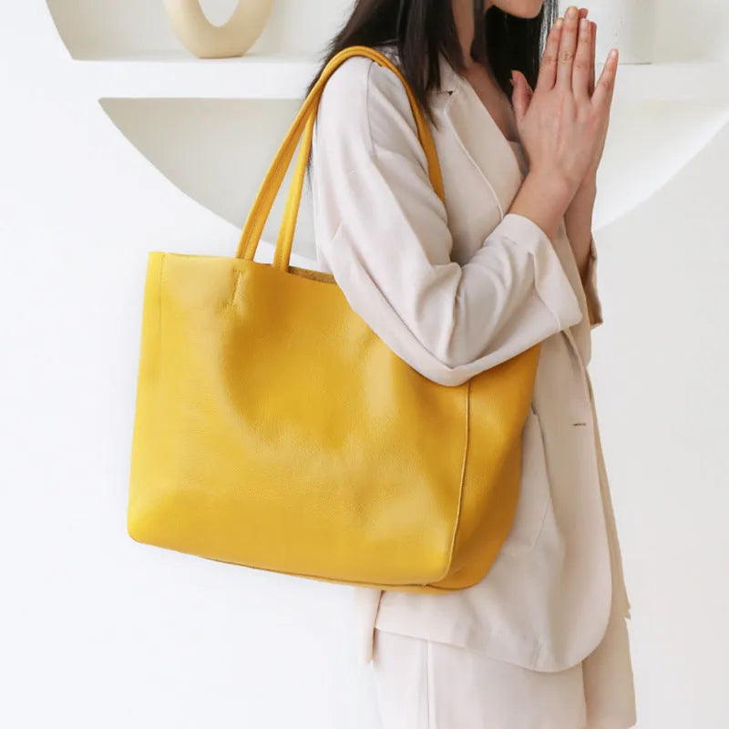 Large first layer cowhide leather tote bag with soft handle, plain design with car stitching, available in multiple colours