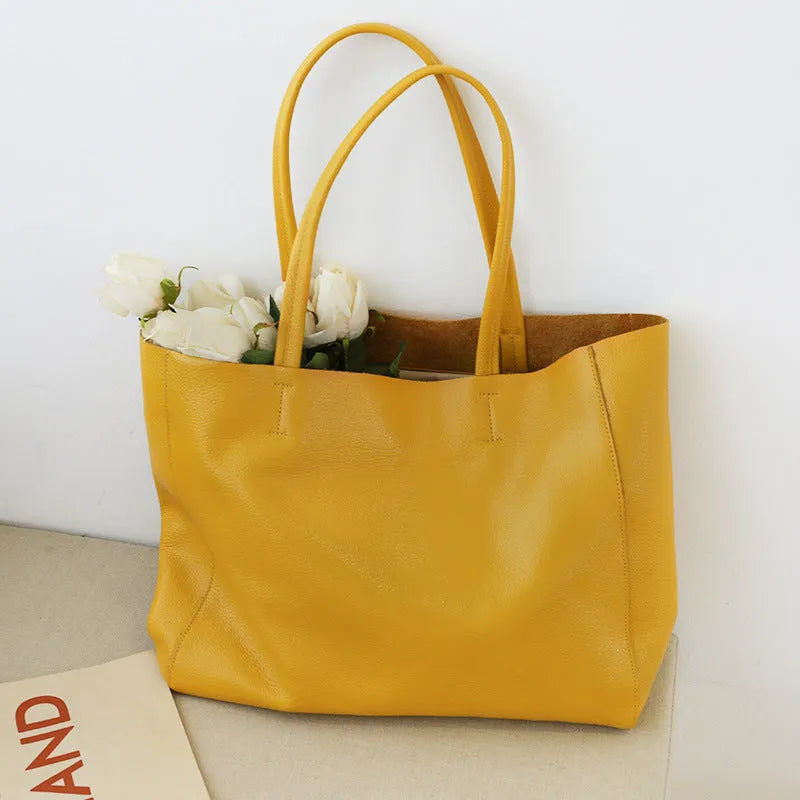 Large first layer cowhide leather tote bag with soft handle, plain design with car stitching, available in multiple colours