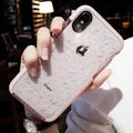 TPU iPhone case with striped back design showing black, pink and white edge colour options