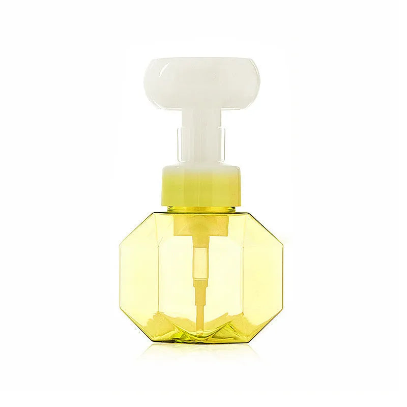Refillable flower foam bottle for liquid soap in pink, green, blue, and yellow colour options.