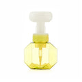 Empty plastic foaming bottle in pink with non-woven fabric insert, side view