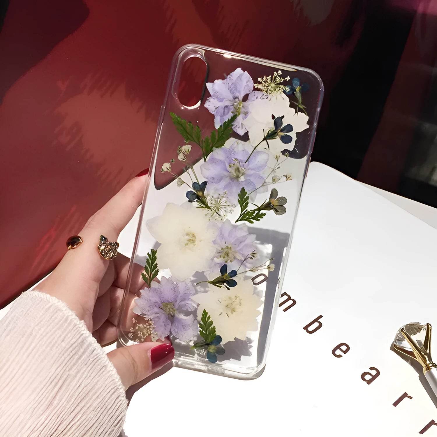 Blue and purple dried flowers design on a soft TPU case for iPhone