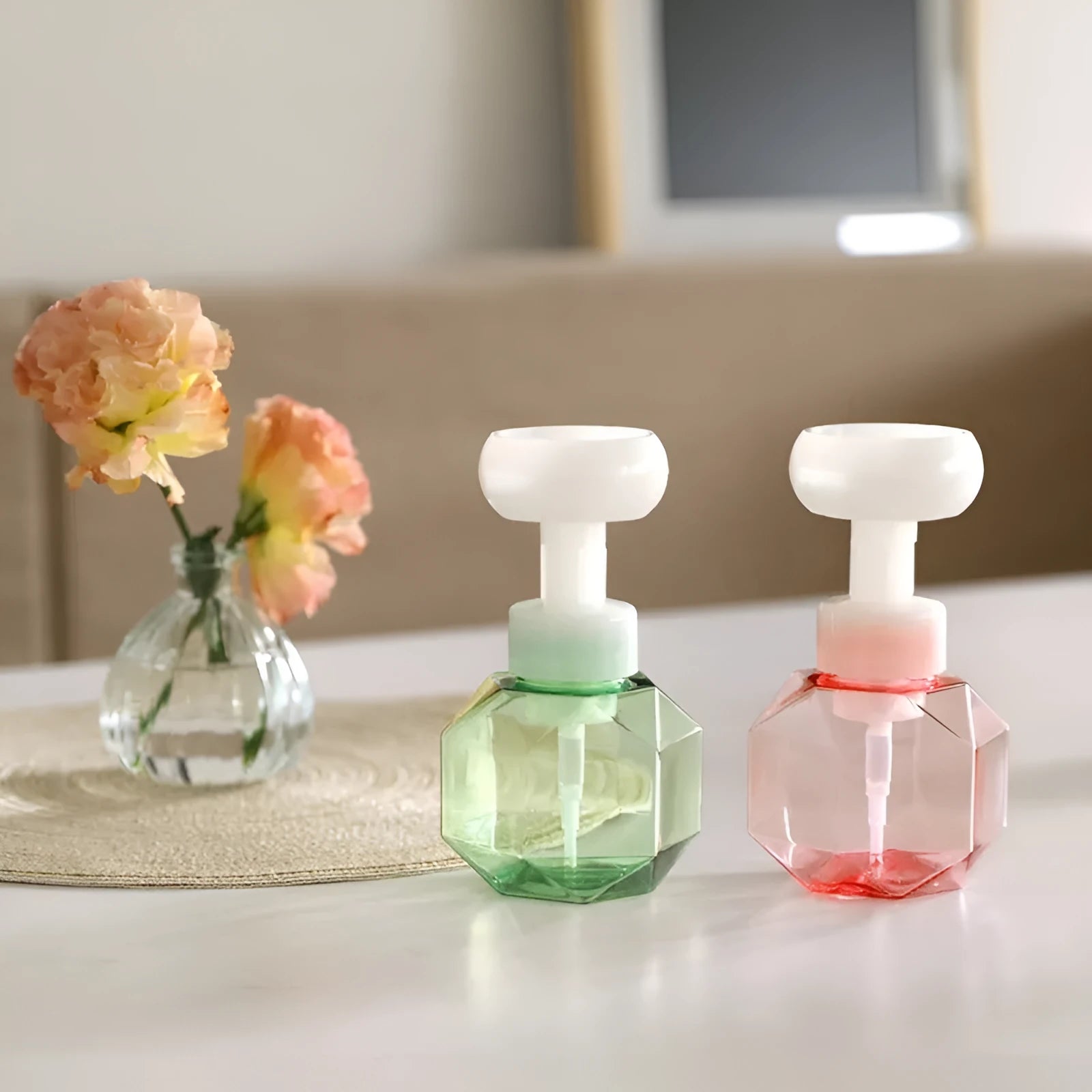 Refillable flower foam bottle for liquid soap in pink, green, blue, and yellow colour options.