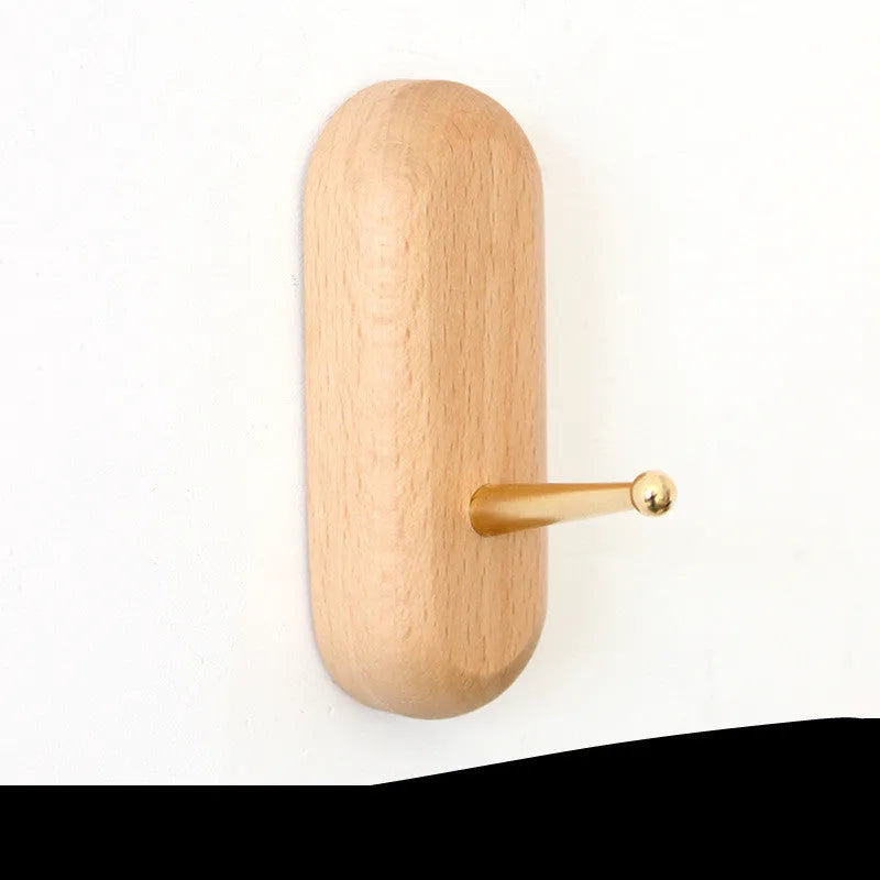 Beech wood adhesive wall hook with brass hook, shown in round, capsule, oval, diamond, and square colour options.