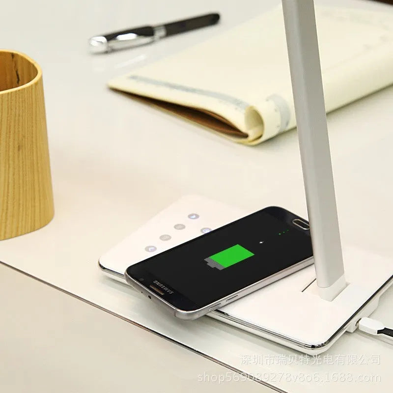 Black wireless charging desk lamp with touch switch and USB cable.