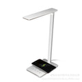 Black wireless charging desk lamp with touch switch and USB cable.