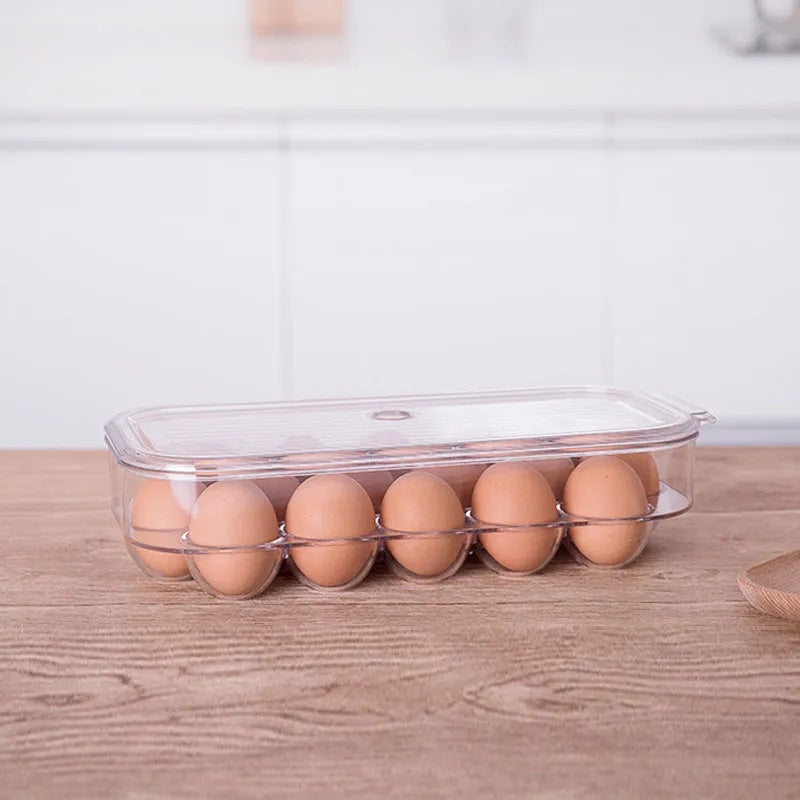 Transparent PET egg storage box for refrigerator, 31.4 cm length, with white background