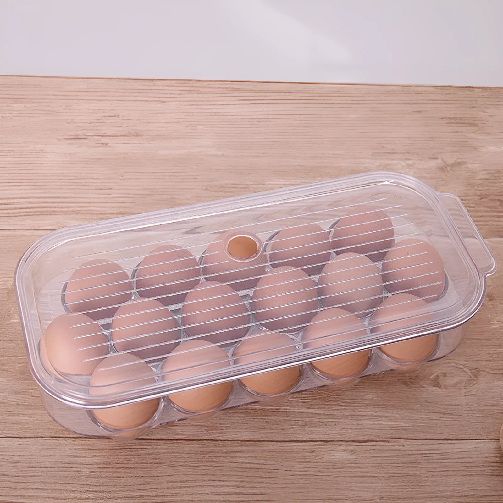 Transparent PET egg storage box for refrigerator, 31.4 cm length, with white background