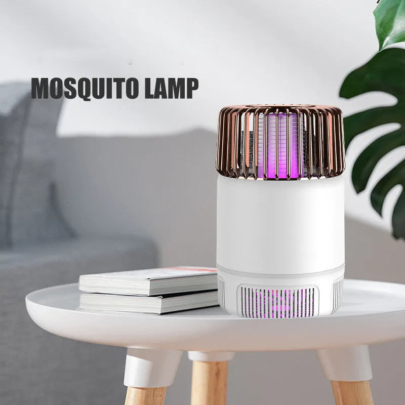Electric mosquito killer lamp with USB power, purple light, and fan in black colour on a wooden table