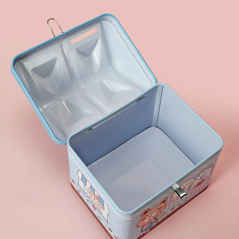 Blue house-shaped tinplate piggy bank for coin saving on desktop