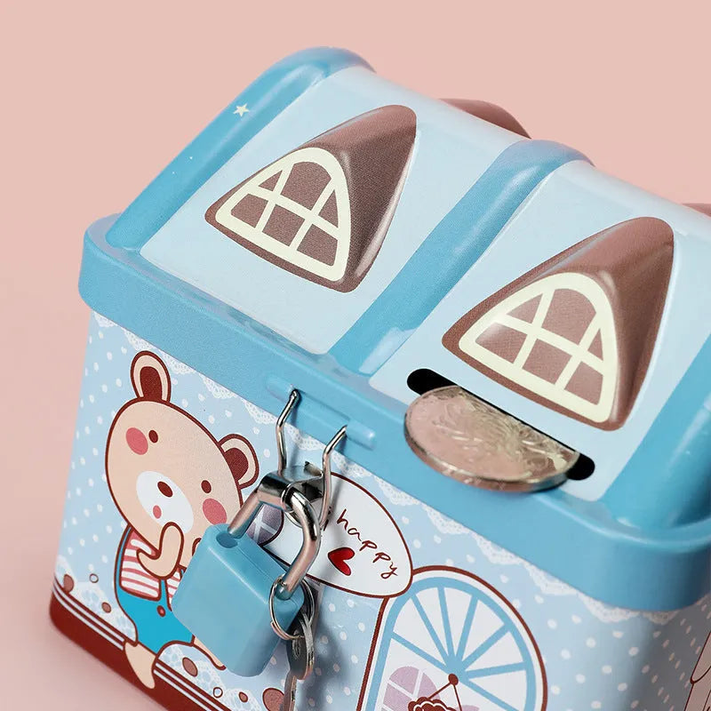 Blue house-shaped tinplate piggy bank for coin saving on desktop